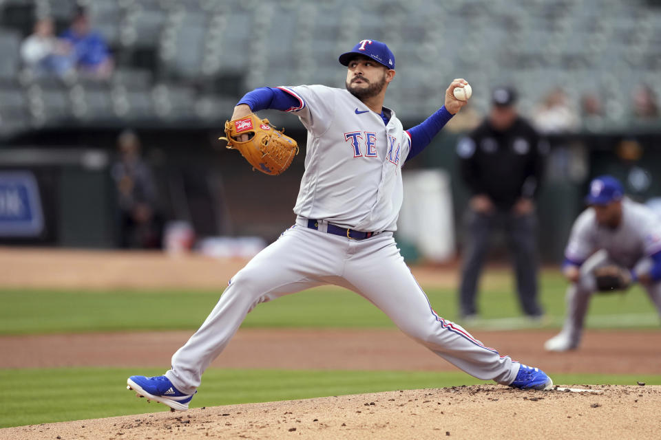 Texas Rangers starting pitcher Martin Perez throws to an Oakland Athletics batter during the first inning of a baseball game Thursday, May 26, 2022, in Oakland, Calif. (AP Photo/Darren Yamashita)