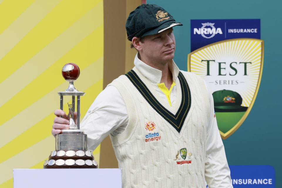 Australia's Steve Smith poses with the trophy after Australia defeated the West Indies on the fourth day of their cricket test match and take the series 2-0 in Adelaide, Sunday, Nov. 11, 2022. (AP Photo/James Elsby)