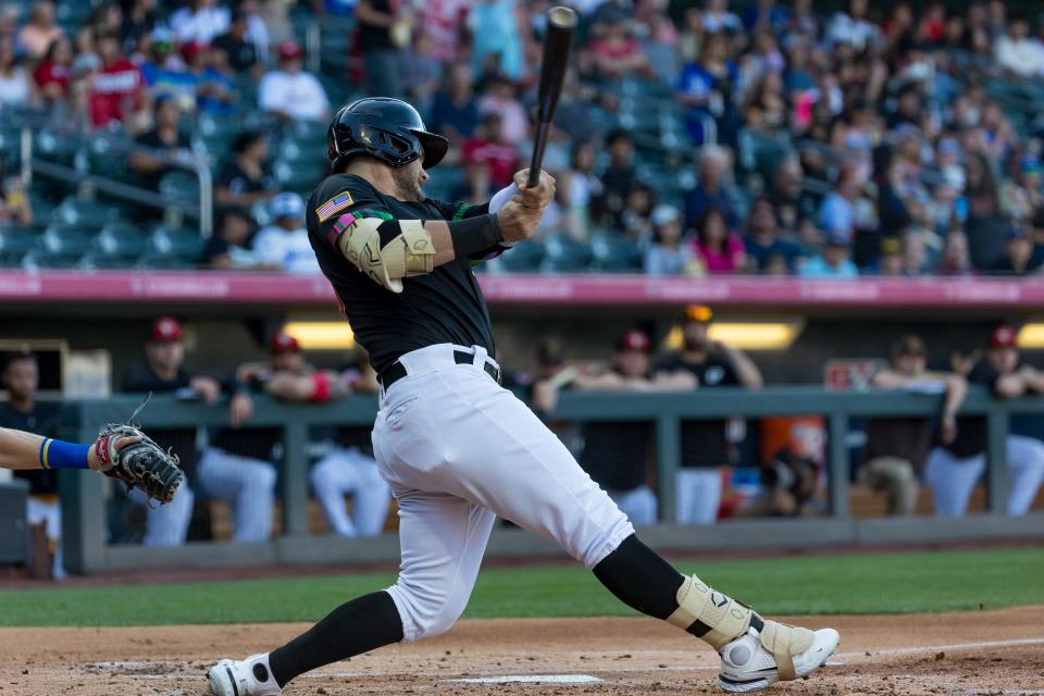 El Paso Chihuahuas' Preston Tucker (50) hits the ball at a PCL Triple-A game against Oklahoma City Dodgers on Thursday, June 8, 2023, at Southwest University Park in Downtown El Paso, Texas.