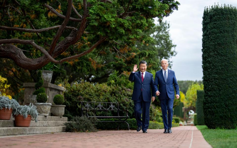 President Joe Biden and China's President President Xi Jinping walk in the gardens at the Filoli Estate