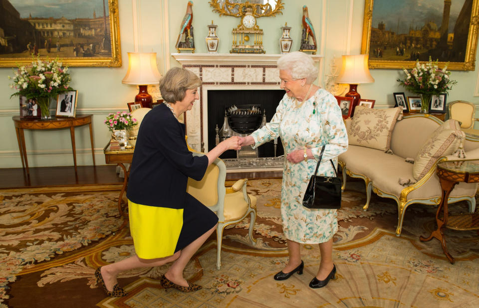 <p>The Queen welcomes prime minister Theresa May at the start of an audience in Buckingham Palace, London, where she invited her to form a new government on 13 July 2016. (PA)</p> 