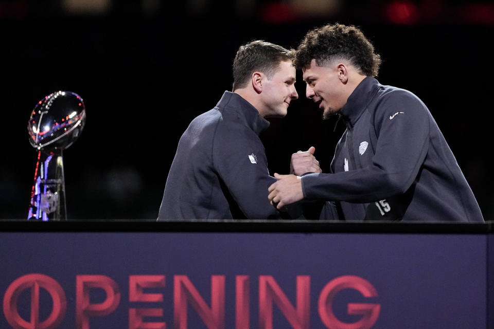 San Francisco 49ers quarterback Brock Purdy and Kansas City Chiefs quarterback Patrick Mahomes shake hands during NFL football Super Bowl 58 opening night Monday, Feb. 5, 2024, in Las Vegas. The San Francisco 49ers face the Kansas City Chiefs in Super Bowl 58 on Sunday.