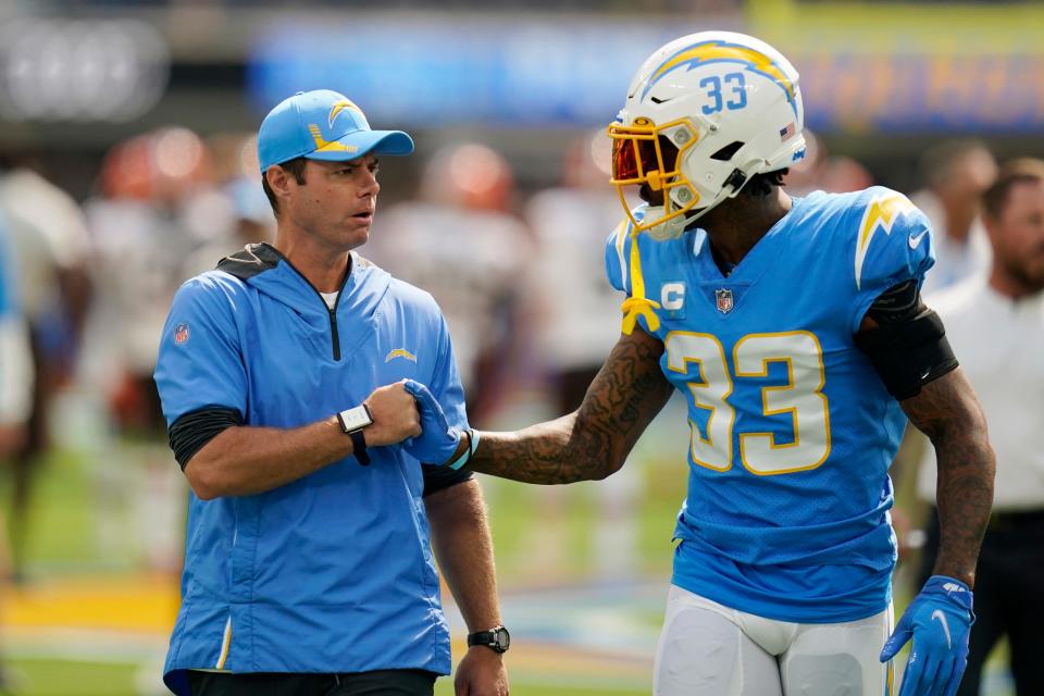 Los Angeles Chargers head coach Brandon Staley shakes hands with free safety Derwin James, who just became the highest paid safety in the NFL.