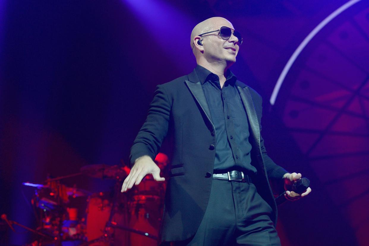 Singer Pitbull is pictured onstage in 2016 at Hard Rock Live! in the Seminole Hard Rock Hotel & Casino in Hollywood, Florida. The Miami-native rapper received $1 million in a deal with Visit Florida, generating controversy about Visit Florida’s purpose and mission.