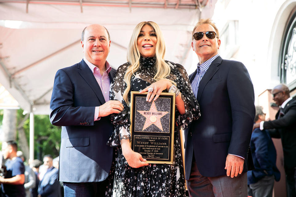 Debmar-Mercury’s Mort Marcus (left) and Ira Bernstein flank Williams at her Walk of Fame ceremony in 2019.