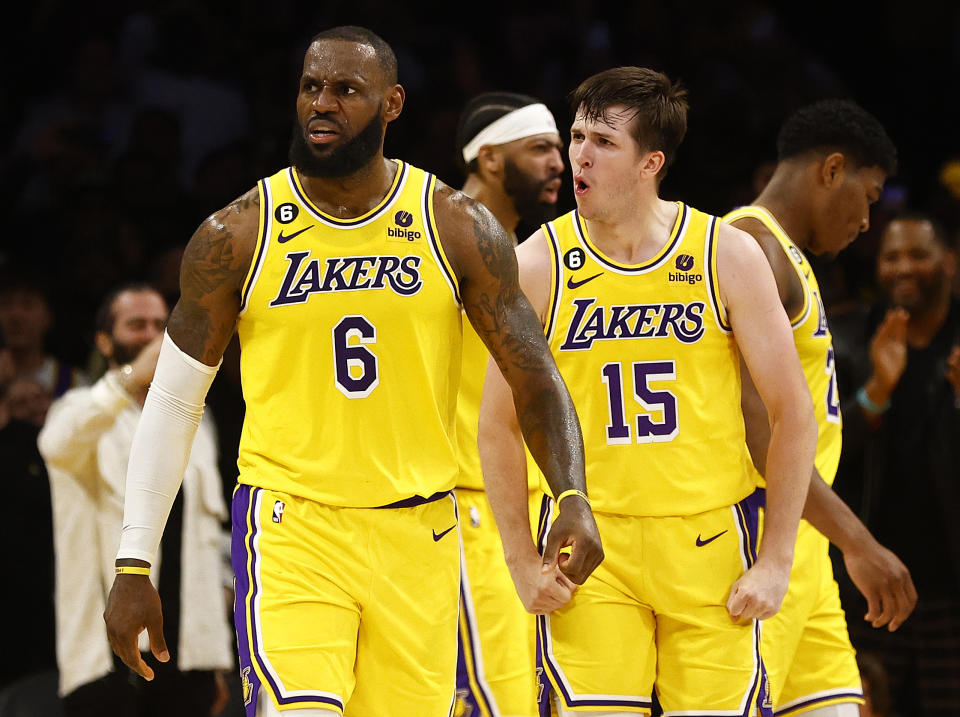 LOS ANGELES, CALIFORNIA - APRIL 24:  LeBron James #6 and Austin Reaves #15 of the Los Angeles Lakers react against the Memphis Grizzlies in overtime of Game Four of the Western Conference First Round Playoffs at Crypto.com Arena on April 24, 2023 in Los Angeles, California.  NOTE TO USER: User expressly acknowledges and agrees that, by downloading and/or using this photograph, user is consenting to the terms and conditions of the Getty Images License Agreement. (Photo by Ronald Martinez/Getty Images)