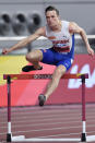 Karsten Warholm, of Norway, competes in a men's 400 meter hurdles race semifinal during the World Athletics Championships in Doha, Qatar, Saturday, Sept. 28, 2019. (AP Photo/Martin Meissner)