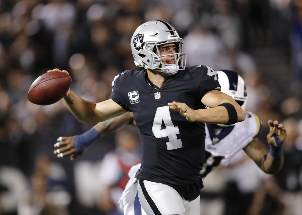 Oakland Raiders quarterback Derek Carr throws during the first half of an NFL football game against the Los Angeles Rams in Oakland, Calif., Monday, Sept. 10, 2018. (AP Photo/John Hefti)