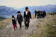 Some 250 people including children had joined the funeral march