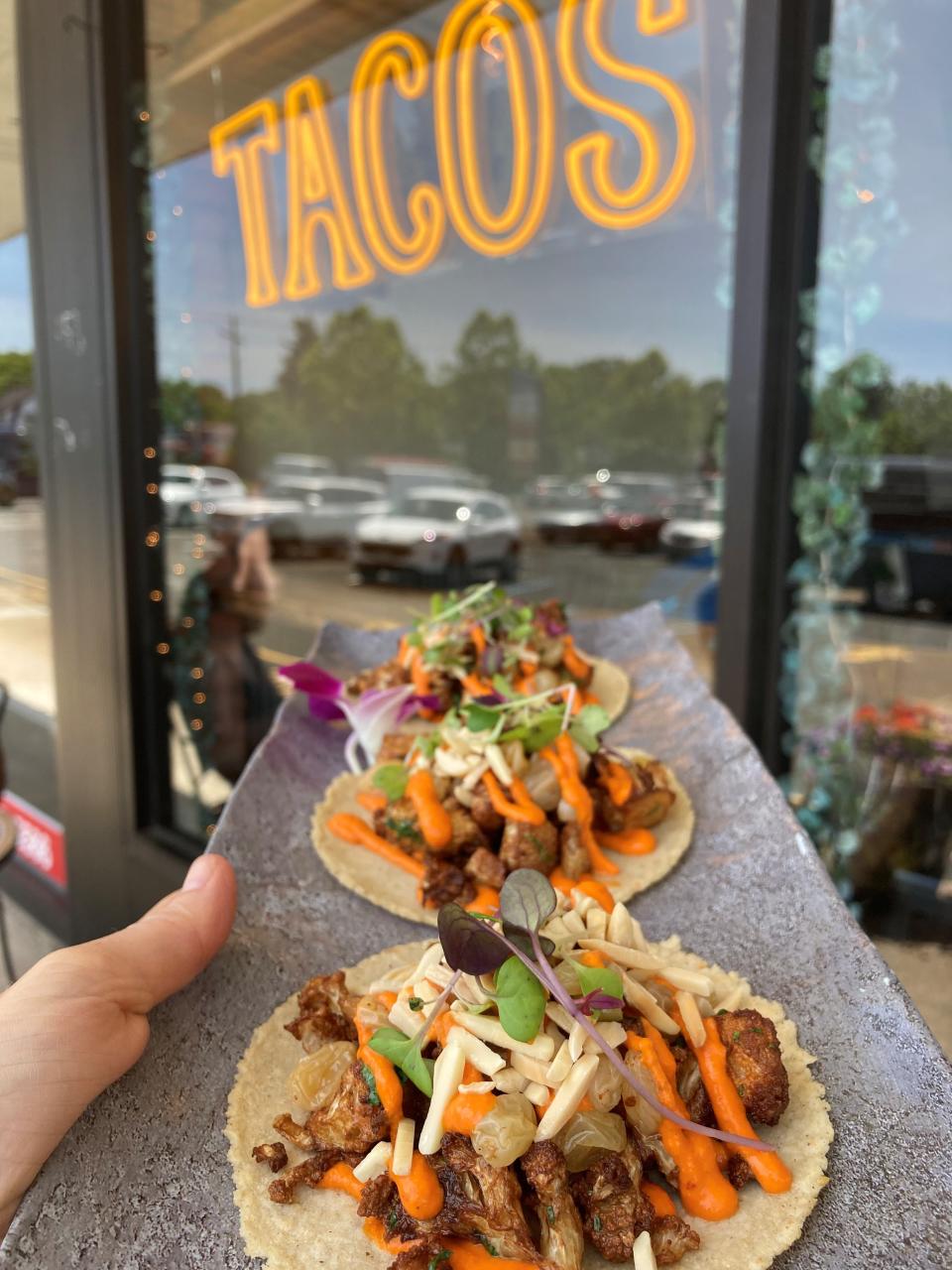 Not your ordinary cauliflower tacos: The ones from Craft Taqueria in New City are made with yogurt and Meyer lemon marinated cauliflower, roasted piquillo pepper romesco, toasted almonds, golden raisins, and fresh herbs.  Photographed June 8, 2022.