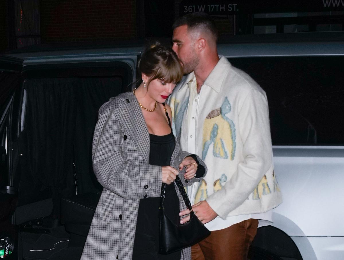 Taylor Swift Wraps Arms Around Travis Kelce in First PDA Shots