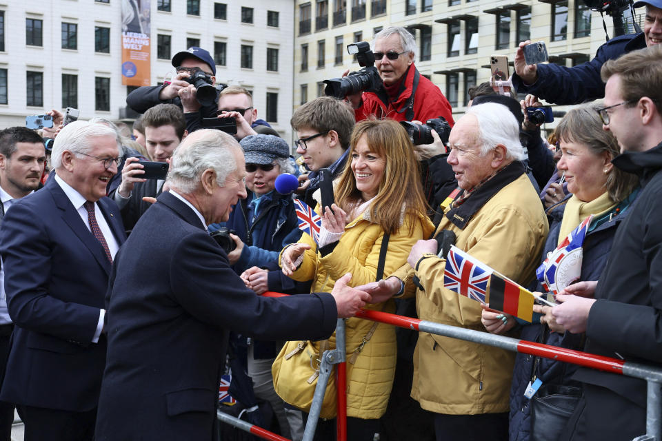 FILE - Britain's King Charles III and German President Frank-Walter Steinmeier greet members of the public in Berlin, Germany, March 29, 2023. King Charles III won plenty of hearts during his three-day visit to Germany, his first foreign trip since becoming king following the death of his mother, Elizabeth II, last year. (Wolfgang Rattay/Pool via AP, File)