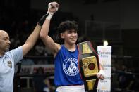 Julian David Lugo wins the 139-pound championship bout on the final night of the 100th year of the Chicago Golden Gloves boxing tournament Sunday, April 16, 2023, in Cicero, Ill. Lugo has Olympic hopes, and he came away from this tournament with the title at 139 pounds. (AP Photo/Erin Hooley)