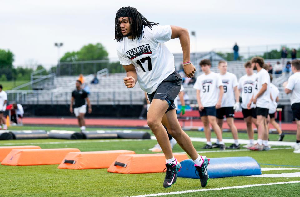 North Penn junior linebacker Christian Johns-Wallace finishes a drill at Thursday's BuxMont Football Showcase.