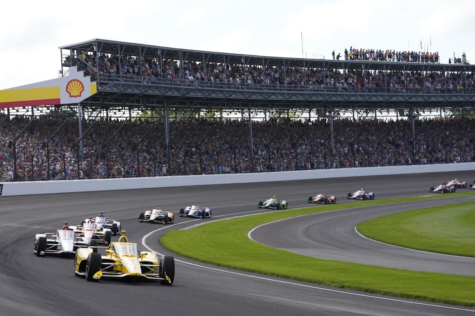 Scott McLaughlin, of New Zealand, leads the field at the start of the Indianapolis 500 auto race at Indianapolis Motor Speedway, Sunday, May 26, 2024, in Indianapolis. (AP Photo/Darron Cummings)