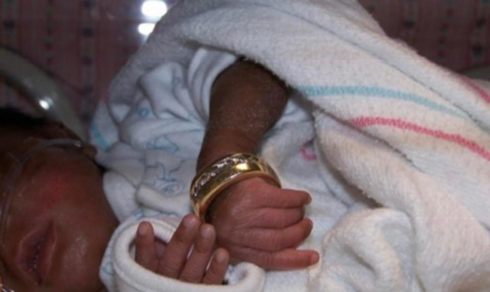 Morgan Hicks as a premature baby. She was so tiny that her father's wedding band could fit around her wrist. She and her two siblings grew up to excel academically and attend Spelman and Morehouse colleges.