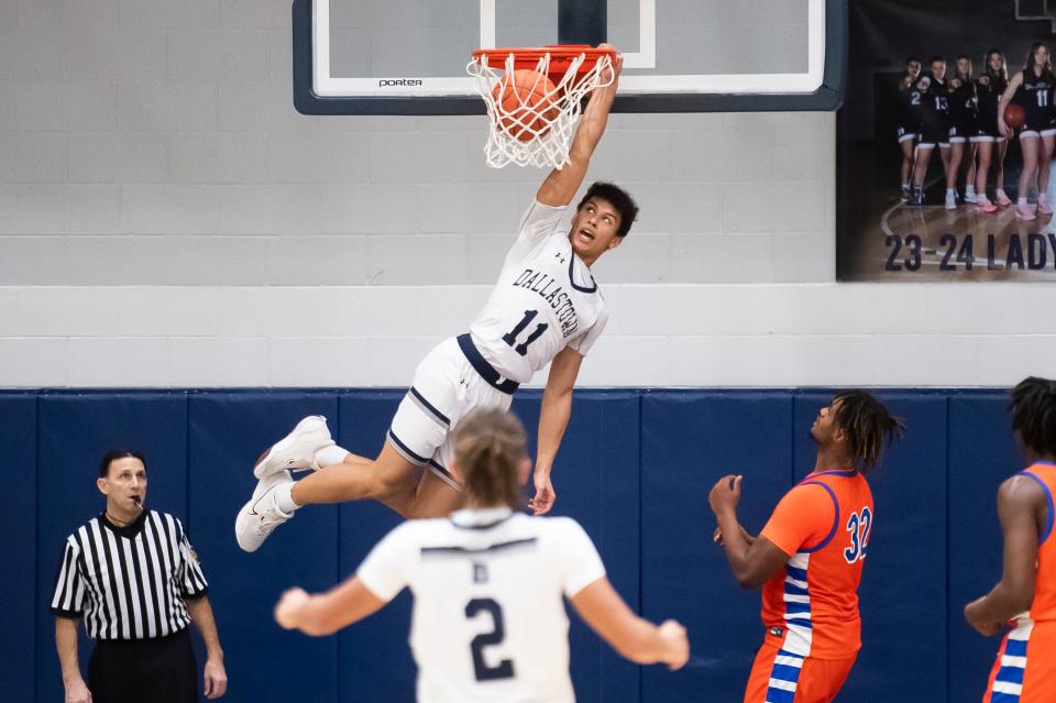 Dallastown's Jalen Cook dunks the ball off an alley-oop during a game against York High this season. Cook was named to the coaches' all-star team.