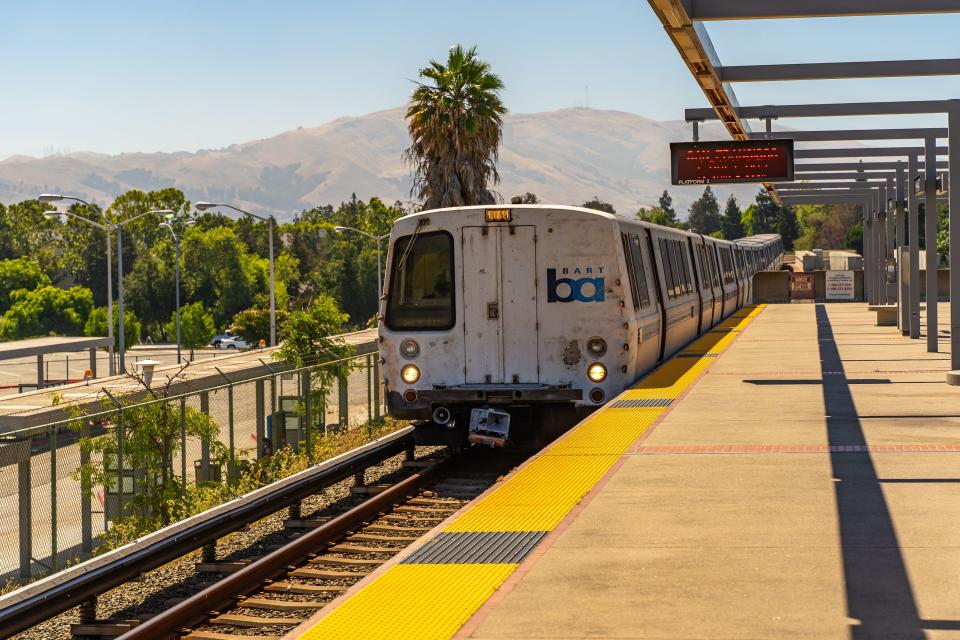 A BART train pulls into a Bay Area station in this undated photo. | Adobe.com