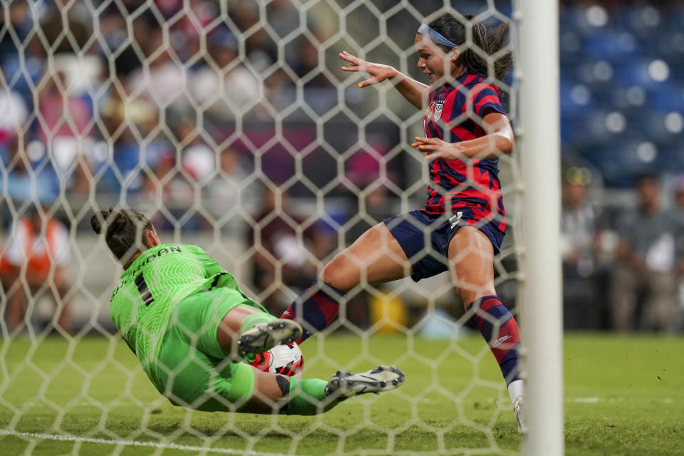 Canada's goalkeeper, Kailen Sheridan (1) blocks a shot by United States' Sophia Smith during the CONCACAF Women's Championship final soccer match in Monterrey, Mexico, Monday, July 18, 2022. (AP Photo/Fernando Llano)