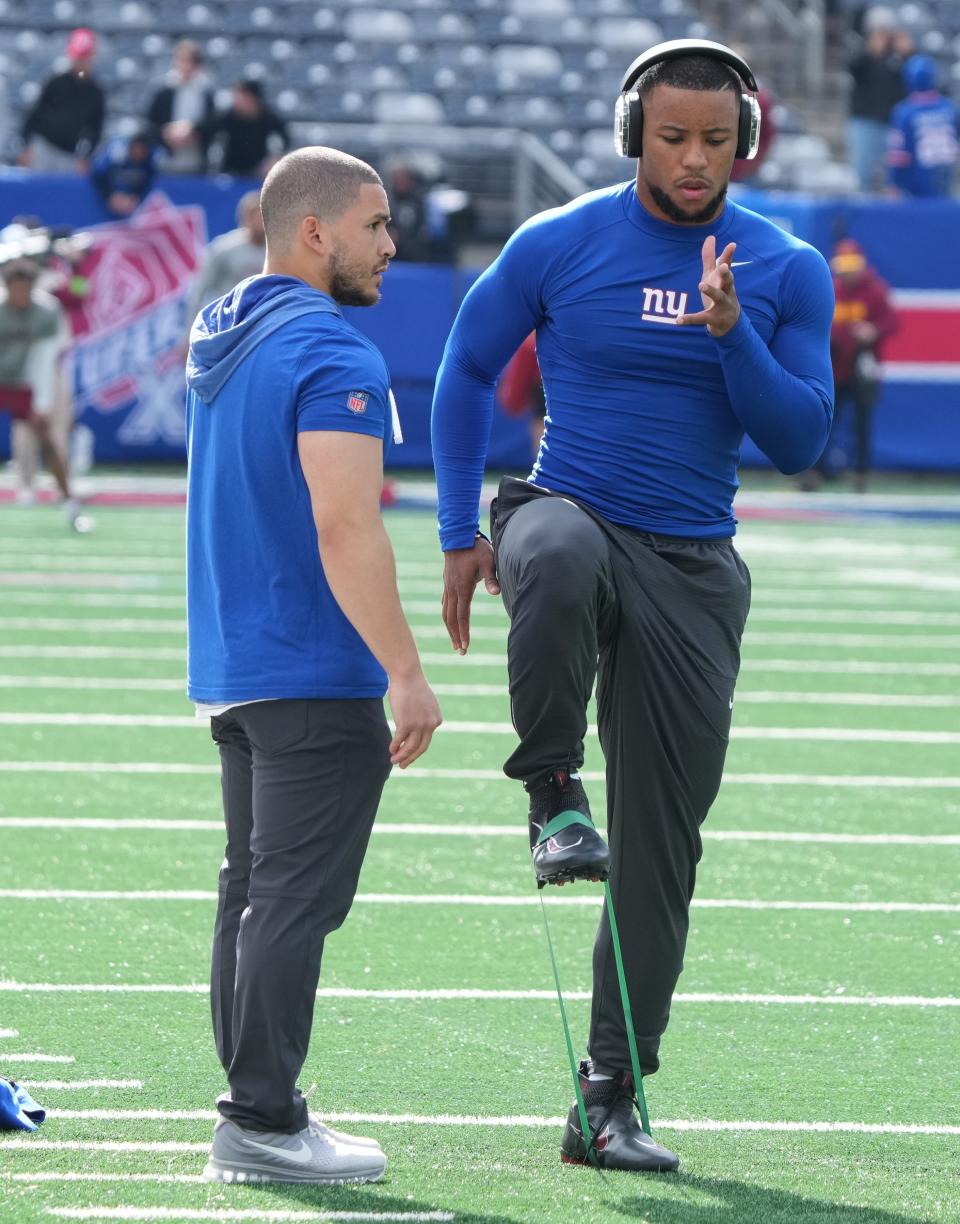 East Rutherford, NJ — October 22, 2023 -- Saquon Barkley of the Giants works out before the game. The NY Giants host the Washington Commanders at MetLife Stadium in East Rutherford, NJ on October 22, 2023.