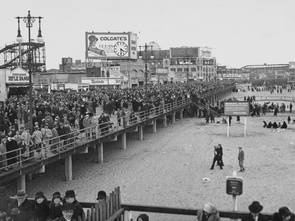 Crowded boardwalk at Coney Island in 1927.