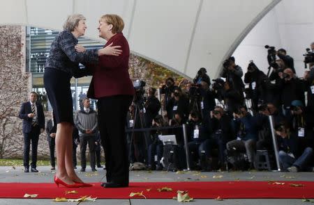 Britain's Prime Minister Theresa May is welcomed by German Chancellor Angela Merkel upon her arrival at the chancellery in Berlin, Germany, November 18, 2016. REUTERS/Fabrizio Bensch