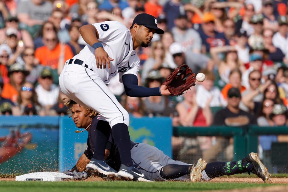 Guardians third baseman Jose Ramirez slides in safe at third for a triple ahead of the throw to Tigers third baseman Jeimer Candelario in the seventh inning on Saturday, May 28, 2022, at Comerica Park.