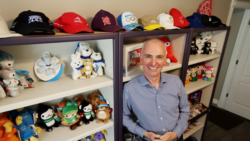 Salt Lake City-Utah Committee for the Games bid lead Darren Hughes poses with some of the Olympic items he has collected over many years of work during an interview at his home in Cottonwood Heights on Friday, July 28, 2023.