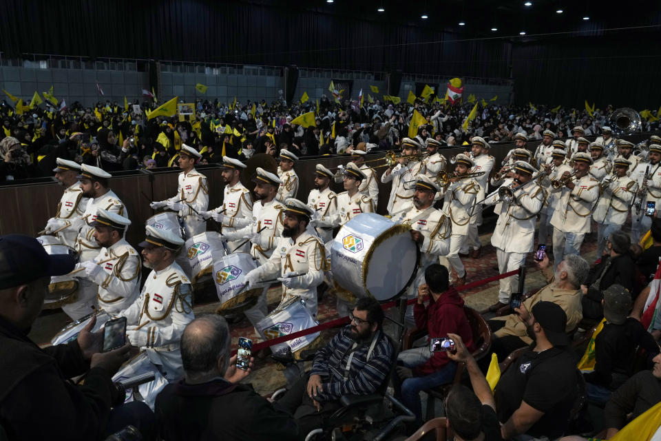 Hezbollah members parade during a rally marking Hezbollah Martyr's Day, in the southern Beirut suburb of Dahiyeh, Lebanon, Friday, Nov. 11, 2022. Hezbollah's chief Hassan Nasrallah said his group wants a new Lebanese president that will not "betray" the Iran-backed faction in the future adding that the United States is doing all it can strangle the group. (AP Photo/Bilal Hussein)