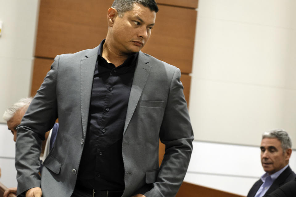 Royer Borges, father of former Marjory Stoneman Douglas High School student Anthony Borges, who was injured in the 2018 shootings, leaves the courtroom after Anthony finished testifying during the trial of former Marjory Stoneman Douglas High School School Resource Officer Scot Peterson, Thursday, June 8, 2023, at the Broward County Courthouse in Fort Lauderdale, Fla. Peterson is charged with child neglect and other charges for failing to stop the Parkland school massacre five years ago. (Amy Beth Bennett/South Florida Sun-Sentinel via AP, Pool)