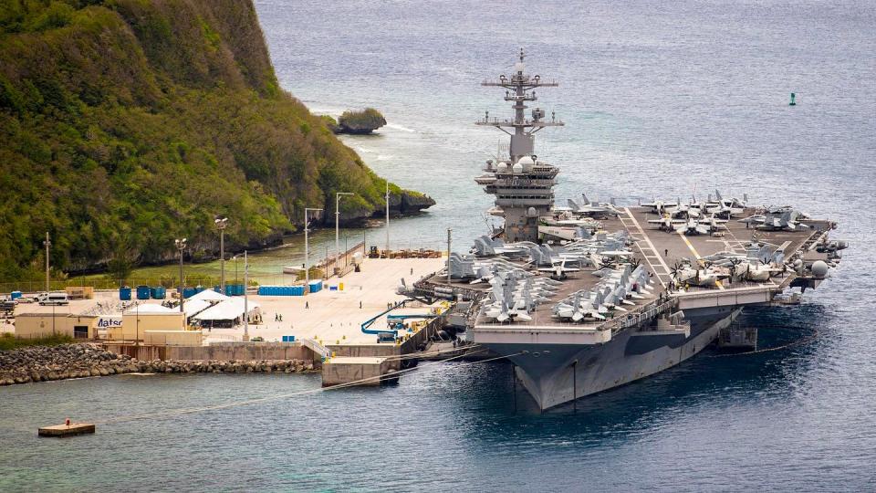 The aircraft carrier USS Theodore Roosevelt (CVN 71) is moored pier side at Naval Base Guam on May 15, 2020. (MC3 Conner D. Blake/Navy)
