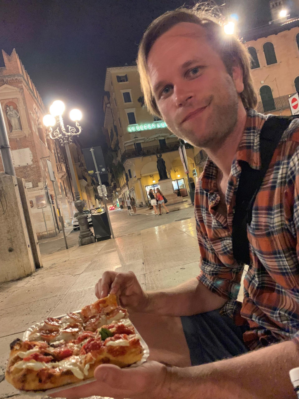 Foodie and avid traveler George Britton dining in Bologna, Italy — a country he loves, with the exception of the random restaurant fees he has encountered there. (Courtesy George and Vanessa Britton)