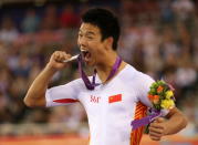 Silver medallist Zhang Yu Li of China poses on the podium during the medal ceremony for the Men's Individual Cycling C1 Pursuit final on day 2 of the London 2012 Paralympic Games at Velodrome on August 31, 2012 in London, England. (Photo by Bryn Lennon/Getty Images)