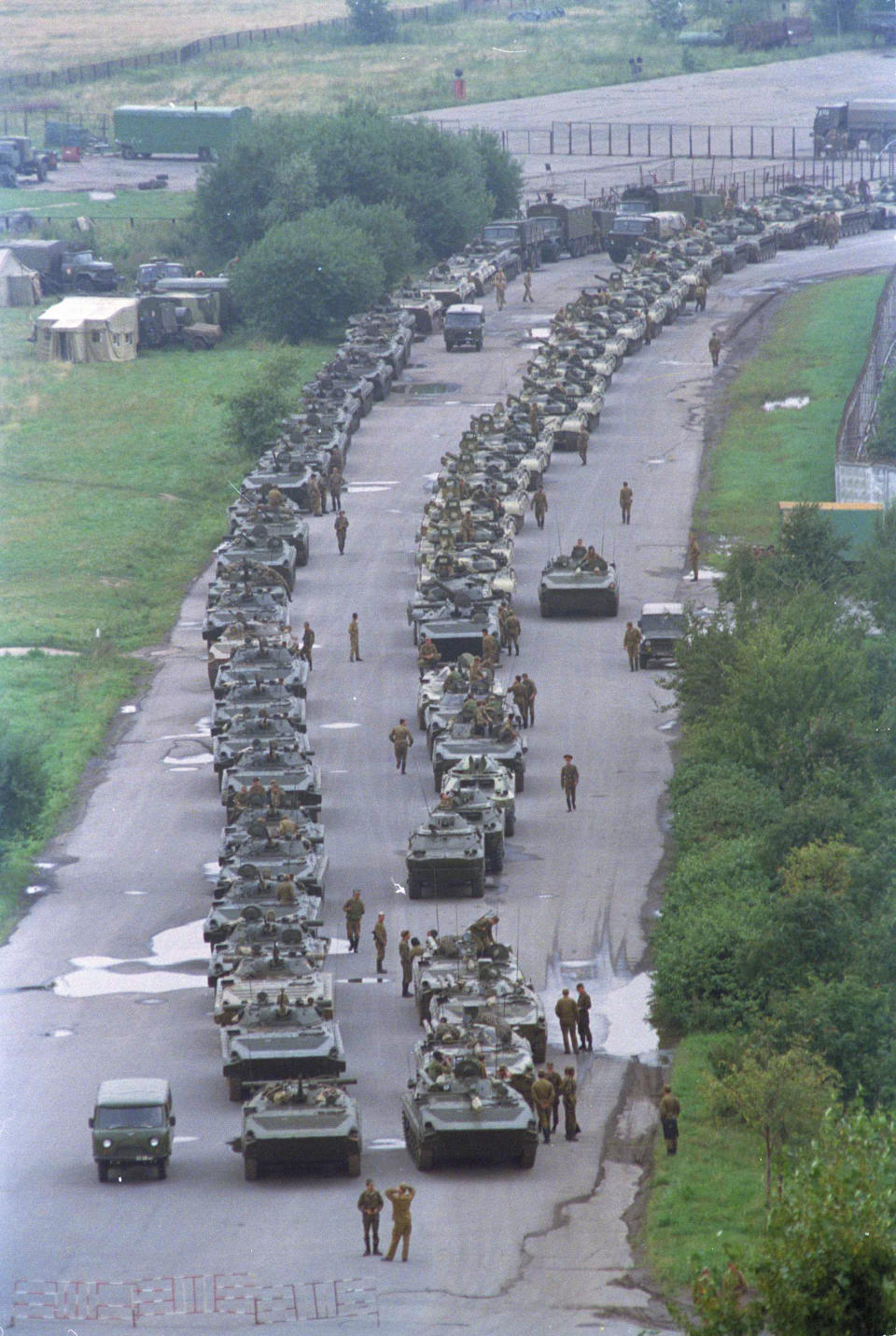 FILE - A convoy of Soviet tanks holds its position near Moscow's central airfield less than two miles from the Kremlin, Aug. 20, 1991. The Communist hardliners who ousted Mikhail Gorbachev sent the army's tanks rolling within a mile of the Russian Parliament building where populist President Boris Yeltsin has been since Monday's coup. (AP Photo/Boris Yurchenko, File)