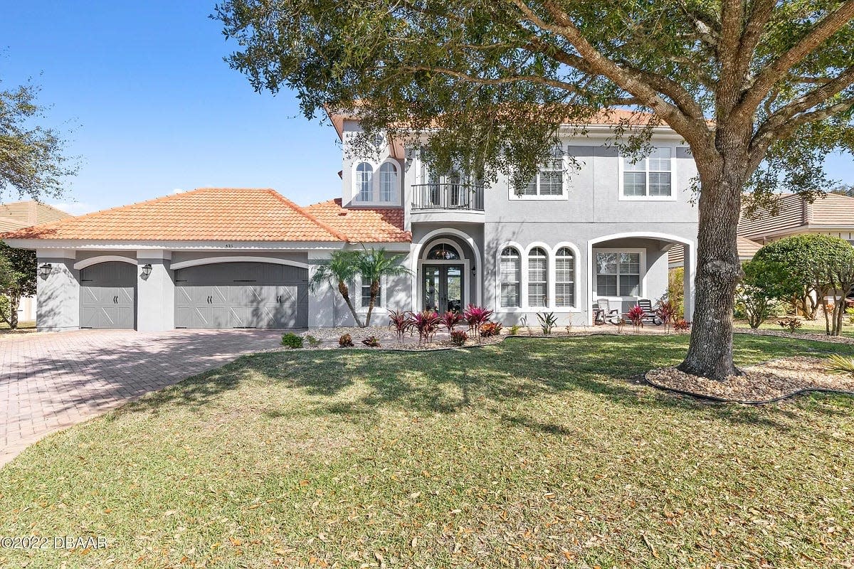 Located in the prestigious Woodbridge Estates section of Plantation Bay, this Ormond Beach pool home is a dream, with golf-course and water views.