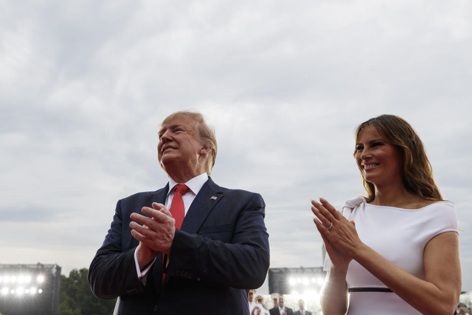 President Donald Trump and first lady Melania Trump look the the crowd as they leave an Independence Day celebration in front of the Lincoln Memorial, Thursday, July 4, 2019, in Washington. (AP Photo/Carolyn Kaster)