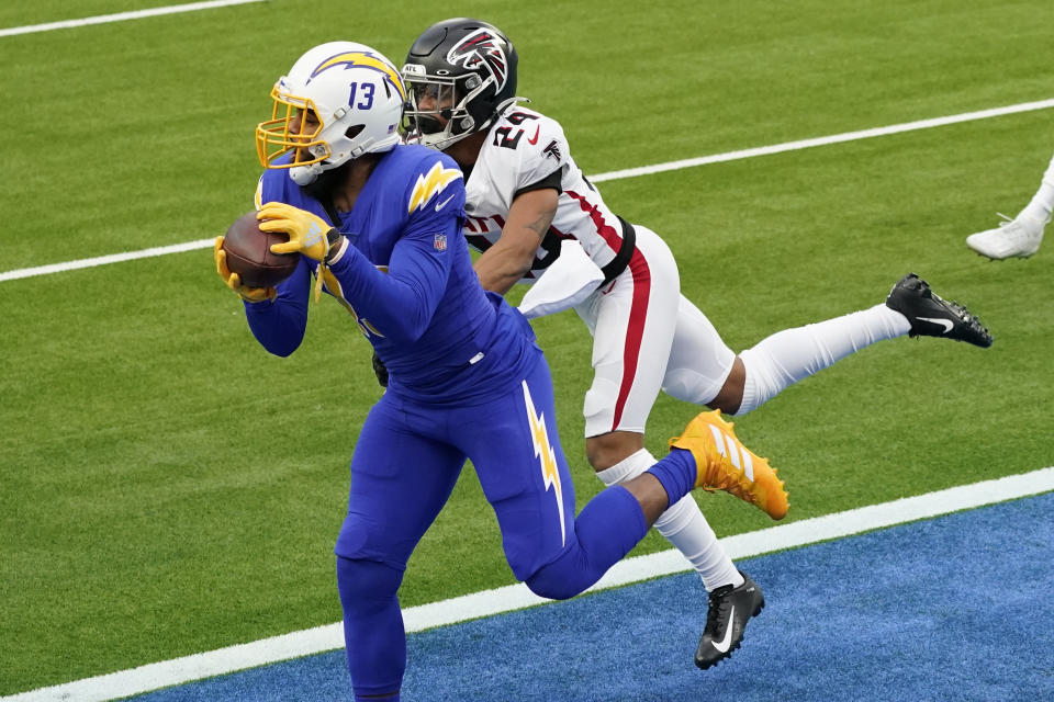 Los Angeles Chargers wide receiver Keenan Allen, left, catches a touchdown pass in front of Atlanta Falcons cornerback A.J. Terrell (24) during the first half of an NFL football game Sunday, Dec. 13, 2020, in Inglewood, Calif. (AP Photo/Ashley Landis)