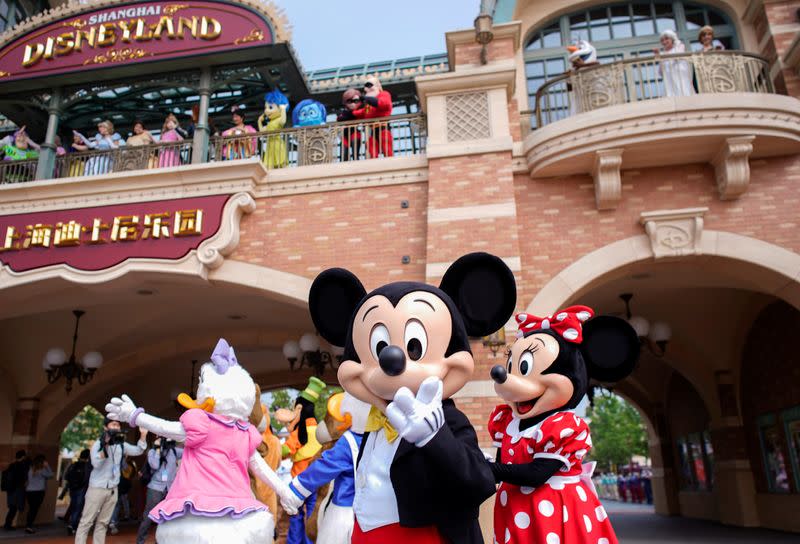 Disney characters Mickey Mouse and Minnie Mouse, among others, greet visitors at Shanghai Disney Resort as the Shanghai Disneyland theme park reopens following a shutdown due to the coronavirus disease (COVID-19) outbreak, in Shanghai