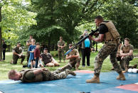 <p>Members of the U.S. Marine Corps (USMC) demonstrate their fighting skills in Brooklyn’s Prospect Park as part of Fleet Week on May 27, 2017 in New York City. At “Marines Day” in the park members of the public had the opportunity to test their strength on chin-up bars, hold military weapons and watch as Marines display their fighting skills.Now in its 29th year, Fleet Week brings more than 3,700 U.S. and Canadian service members to Manhattan through Memorial Day. The event includes ship tours, military demonstrations, musical performances and other events. (Photo: Spencer Platt/Getty Images) </p>