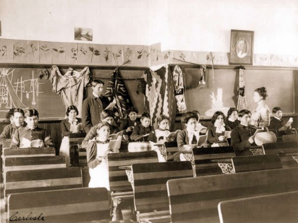 PHOTO: Male and female students read in class at the Carlisle Indian School, in Carlisle, Penn., 1901. (Francis Benjamin Johnston/Buyenlarge via Getty Images)