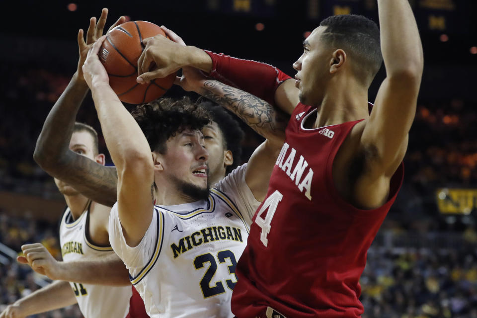 Michigan forward Brandon Johns Jr. (23) is defended by Indiana forward Trayce Jackson-Davis (4) during the second half of an NCAA college basketball game, Sunday, Feb. 16, 2020, in Ann Arbor, Mich. (AP Photo/Carlos Osorio)