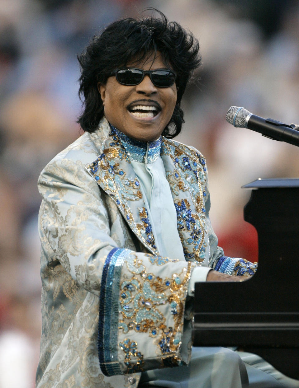 FILE - Little Richard performs during halftime at the Liberty Bowl in Memphis, Tenn. on Dec. 31, 2004. ESPN is changing their “Monday Night Football” theme song. The season will feature a new version of Little Richard's hit “Rip It Up,” featuring new instrumentals and backup vocals from the Virginia-based band Butcher Brown. Hank Williams Jr. had sung the theme song for years in a version of his hit “All My Rowdy Friends Are Coming Over Tonight." (AP Photo/Mark Humphrey, File)