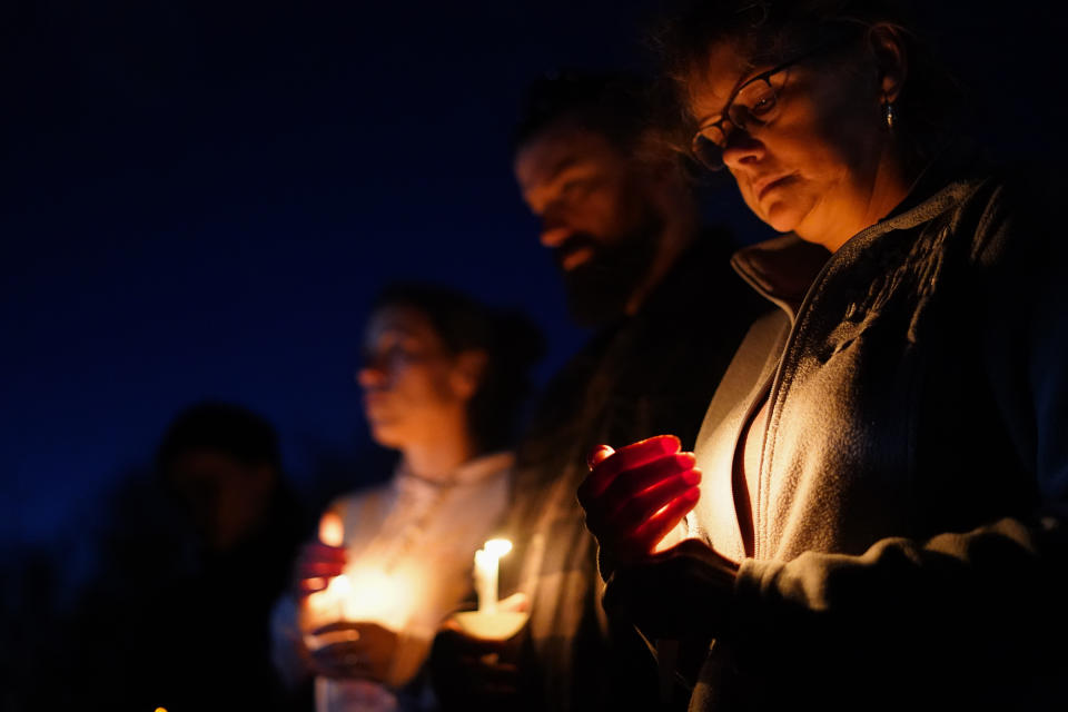 People gather at a vigil in Lisbon, Maine, for victims of the week's mass shootings, Saturday, Oct. 28, 2023. (AP Photo/Matt Rourke)