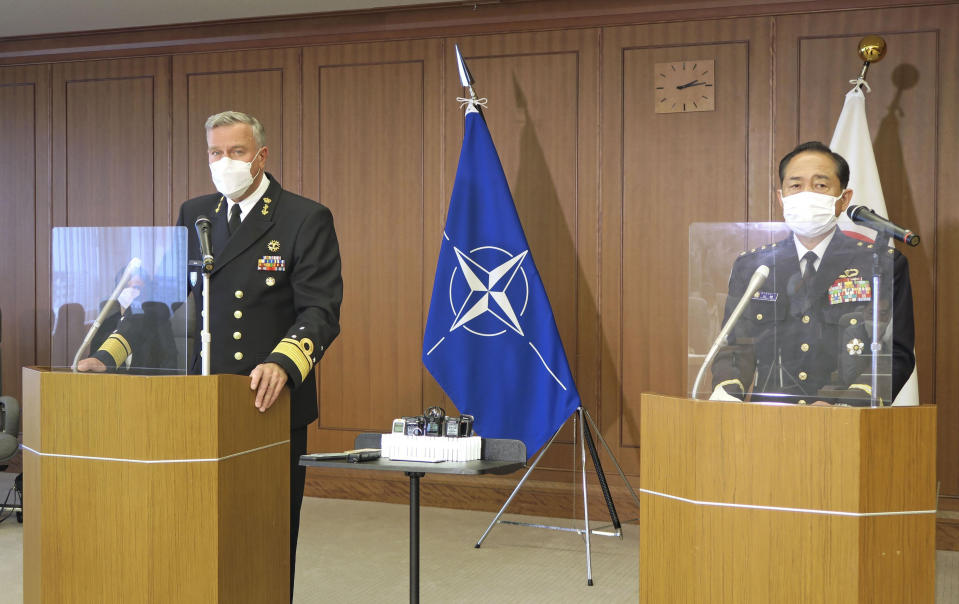 NATO Military Committee chief Rob Bauer, left, and Japanese Chief of Staff Koji Yamazaki, right, attend the joint press conference at the defense ministry in Tokyo, Tuesday, June 7, 2022. Japanese and NATO officials on Tuesday agreed to step up their military cooperation and joint exercises in each other’s regions as the two sides as they share concern that Russia’s invasion of Ukraine is deteriorating the security environment in Europe and Asia.(Kyodo News via AP)