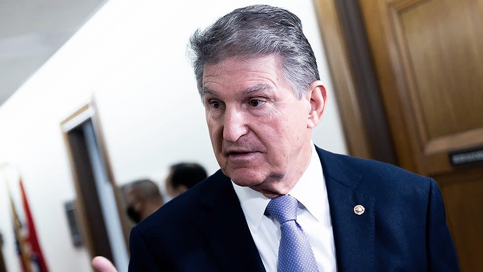 Sen. Joe Manchin (D-W.Va.) speaks to reporters prior to a  Senate Energy and Natural Resources Committee hearing  on Tuesday, Nov. 16, 2021.