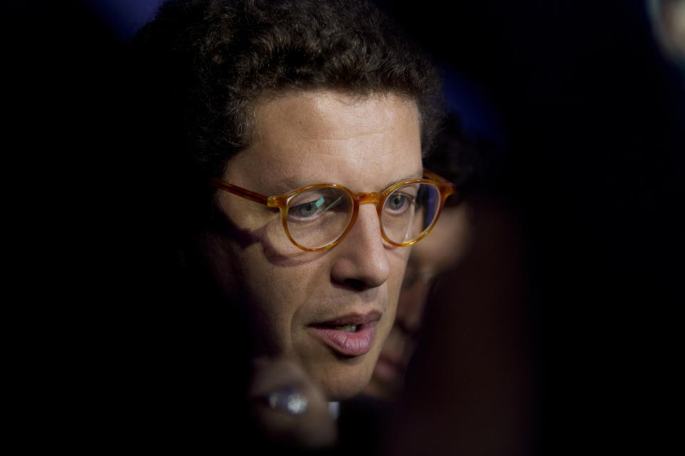 Brazil's Environment Minister Ricardo Salles speaks during the Latin America and Caribbean Climate Week workshop in Salvador, Bahia state, Brazil, Wednesday, Aug.21, 2019. Brazil is hosting a week-long UN workshop on climate change in the northern state of Bahia, which the environment minister tried to cancel earlier this year. (AP Photo/Arisson Marinho)