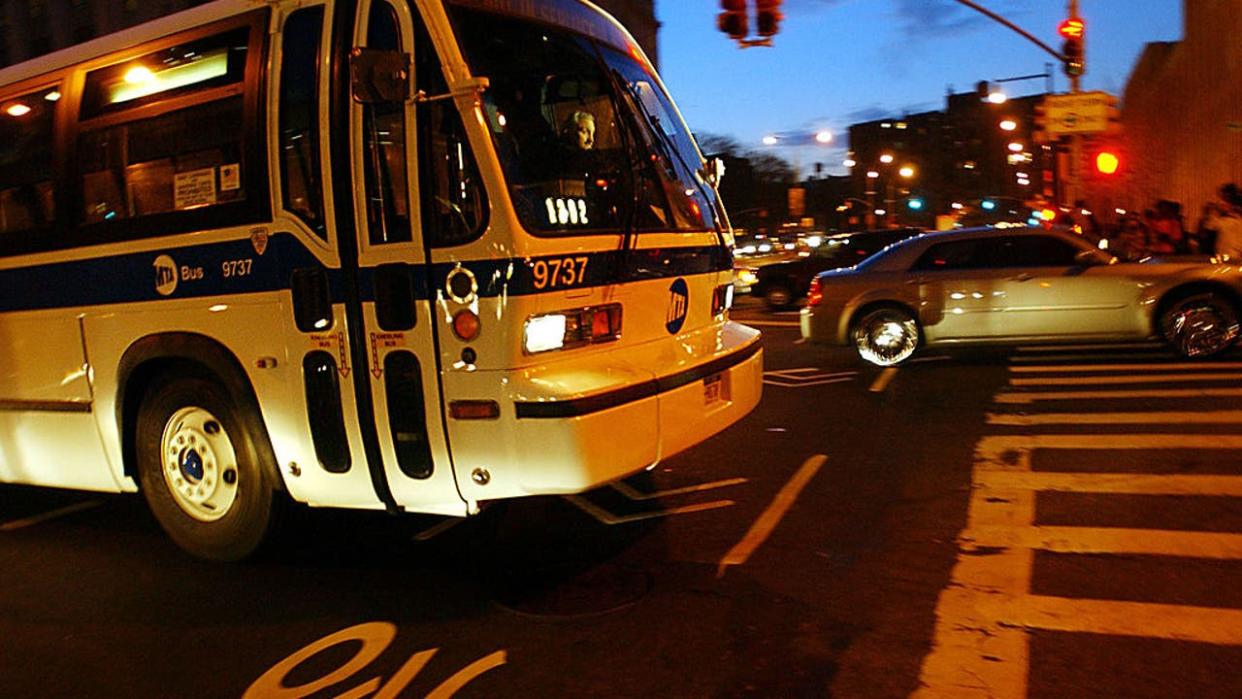 <div>UNITED STATES - DECEMBER 22: An MTA bus is seen traveling near the Brooklyn Bridge in Brooklyn, New York Thursday, December 22, 2005. Striking subway and bus workers in New York City ended a three-day walkout today. Transport Workers Union Local 100 leaders agreed to call off the strike while negotiations on a contract resume, said Richard Curreri, a state mediator. (Photo by Ramin Talaie/Bloomberg via Getty Images)</div>