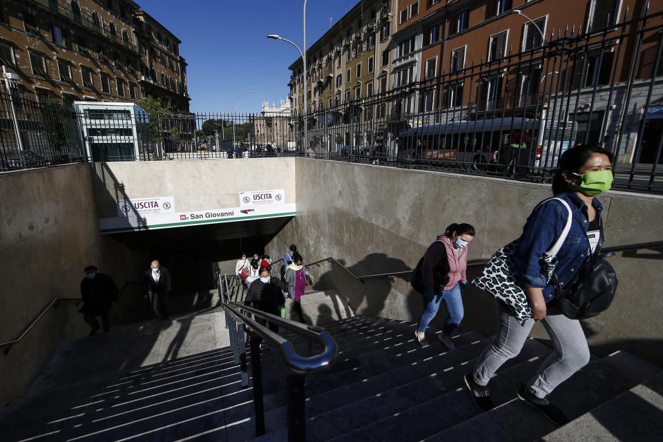 Image: People flow out of San Giovanni subway station in Rome (Cecilia Fabiano / AP)