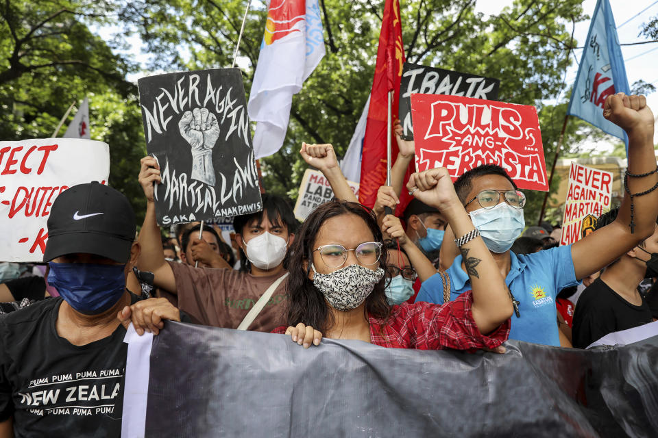 Activists protest against presidential frontrunner Ferdinand "Bongbong" Marcos and running mate Sara Duterte, daughter of the current president, during a rally at the Commission on Human Rights in Quezon City, Metro Manila, Philippines on Wednesday. May 25, 2022. Marcos Jr. continues to lead in the official canvassing of votes. (AP Photo/Basilio Sepe)
