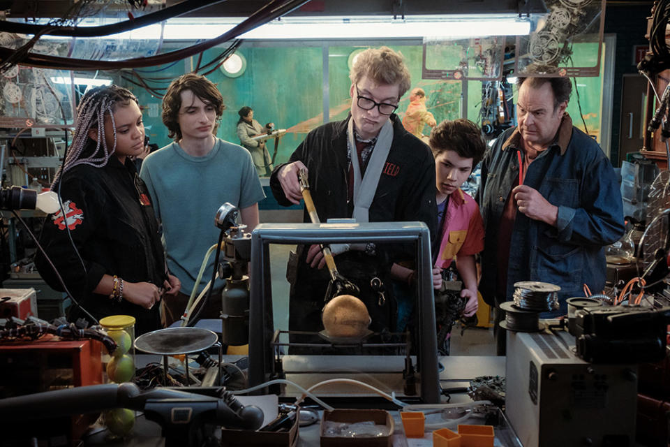 Lucky (Celeste O’Connor), Trevor (Finn Wolfhard), Lars Pinfield (James Acaster), Podcast (Logan Kim) and Ray (Dan Aykroyd) in Columbia Pictures’ GHOSTBUSTERS: FROZEN EMPIRE.